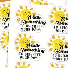 four stickers with the words little something to brighten your day