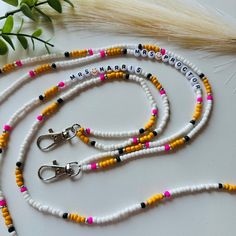 This lanyard is hand beaded with seed beads onto a nylon string and ended with a plastic break away clasp for safety.  *SIZING* Average length of 18-19 inches (from the back of the neck to the bottom of last bead). Please let me know if shorter or longer.  *BREAKAWAY CLASP* Is not to be used to take lanyard on and off. The breakaway clasp is supposed to be used in the event of emergency or accidental catches.  *SHIPPING & PACKAGING*  USPS is my shipping provider. Lanyards are packaged in a padded bubble mailer to protect the lanyard during the shipping process. Depending on the amount of lanyards purchased, they may be shipped in a box only. My shop provides free shipping after $35 in items. * DISCLAIMER * Due to small parts, keep away from babies and small children. Since all phones and s Adjustable Beaded Chain Lanyard For Gift, Adjustable White Lanyards For Crafting, White Adjustable Lanyards For Crafting, Adjustable Orange Beaded Necklace With Letter Beads, Handmade White Beaded Necklaces For Personal Use, White Handmade Beaded Necklaces For Personal Use, Adjustable White Beaded Necklace With Lobster Clasp, White Adjustable Beaded Necklace With Lobster Clasp, Adjustable White Letter Beads Craft Supplies