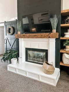 a living room filled with furniture and a flat screen tv on top of a fireplace