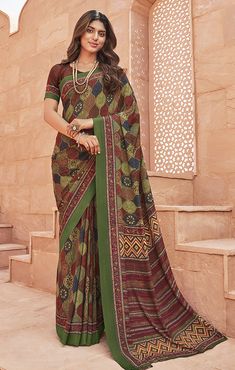 This Saree is Ready to Wear (With Fall and Pico Done). A designer saree Olive Green & Wine in color. It has intricate design all over the saree. This saree is a suitable amalgamation of style and grace that is required from an ethnic wear. The saree is ideal for any formal gathering. The saree comes with an unstitched blouse of corresponding color and design as shown in the picture. Crepe Designer Olive Green & Wine Color Saree Fabric Type: CrepePrimary Color: Olive GreenSecondary Color(s): - Wi Multicolor Pre-draped Saree For Eid, Festive Georgette Kalamkari Dupatta, Georgette Dupatta With Kalamkari Print In Traditional Drape, Traditional Kalamkari Print Georgette Pre-draped Saree, Traditional Kalamkari Pre-draped Georgette Saree, Traditional Georgette Dupatta With Kalamkari Print, Traditional Kalamkari Print Georgette Dupatta, Traditional Kalamkari Print Georgette Blouse Piece, Traditional Kalamkari Print Georgette Saree