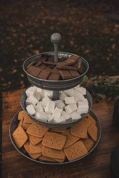 three tiered platter filled with marshmallows and graham's crackers