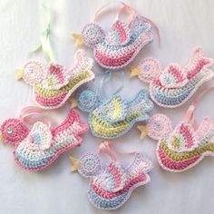 crocheted baby bib and booties are shown