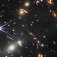 an image of many different objects in the sky with bright lights and stars around them