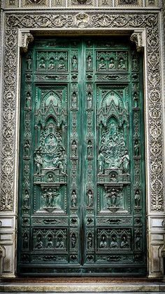 an ornate wooden door with carvings on it