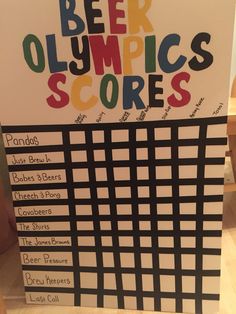 a beer olympics score board sitting on top of a table