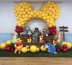 winnie the pooh birthday party with balloons and decorations