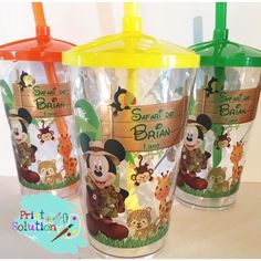 three mickey mouse tumblers with straws on them