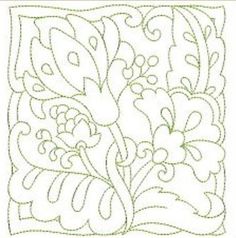 a quilted square with flowers and leaves on it's side, in green