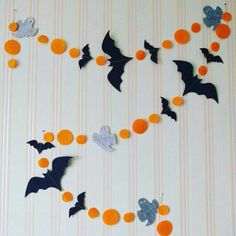 some bats and orange balls on a wall