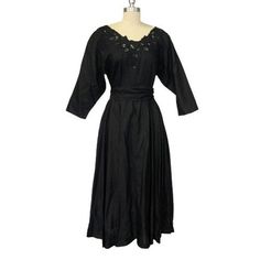 Stunning Nancy Johnson for Prisma vintage 70s or 80s black ramie cotton blend fit and flare button back dress with belted tie waist. Embroidered lace collar with sheer detailing. Material still has sizing, appears unworn. Full skirt with deep pockets. No flaws noted.  Measurements are approximate, lying flat.  18" Bust pit to pit 15" Across the waist 50" Length shoulder to hem Button Back Dress, Vintage Black Dress, Lace Collar, 50s Fashion, Back Dress, Embroidered Lace, Linen Dress, Dress Clothes For Women, Fit And Flare Dress