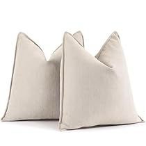 two white pillows sitting on top of each other