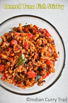 a glass bowl filled with food on top of a table