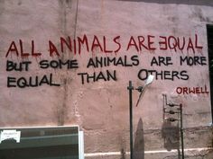 graffiti on the side of a building that says all animals are equal but some animals are more equal than others