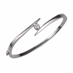 Our solitaire bangle bracelet is set with a fine-quality diamond that weighs 0.25ct. The hinged bracelet weighs 13 grams and is available in 14k white, yellow, and rose gold. Elegant Polished Bangle Diamond Bracelet, Classic White Gold Bangle With Single Diamond, Timeless Formal Bangle With Single Diamond, Elegant Single Diamond Bangle Bracelet, Minimalist Brilliant Cut Bangle For Formal Occasions, Modern White Gold Diamond Bracelet With Polished Finish, Timeless Single Diamond Bangle Bracelet, Formal Fine Jewelry Bangle With Single Diamond, Modern Wedding Diamond Bracelet With Polished Finish