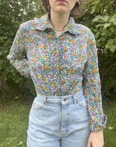 Vintage 1990s does 1970s Button down floral blouse  Adult small  In good vintage condition  No flaws to note  Measurements shown in the photos  No refunds  Happy to answer any questions!  Thank you! Vintage Button-up Top With Vintage Print, Vintage Cotton Shirt With Floral Print, Vintage Multicolor Floral Print Shirt, 90s Style Button-up Tops For Spring, Retro Spring Blouse With Button Closure, Casual Button-up Top With Vintage Pattern, Retro Spring Button-up Shirt, Spring Retro Button-up Blouse, 1970s Button-up Spring Top