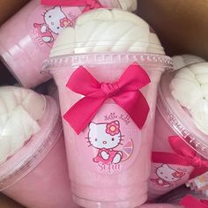 pink hello kitty cups with bows on them