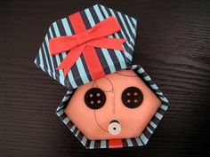 an origami doll with a hat on it's head