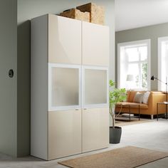 a living room filled with furniture next to a window