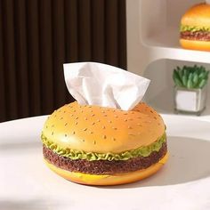 a hamburger sitting on top of a white plate