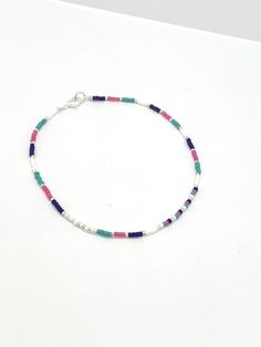 Turquoise, royal blue, pink and white seed bead anklet Dimensions Seed beads are 2mm glass Plated findings An extender is available Postage: UK: Items are sent 2nd class mail, but can be upgraded to 1st class mail for a small fee at checkout. International orders are sent by Standard Royal Mail - untracked. An upgrade is available at checkout. Thank you for visiting and please come back again. If you have any queries, please don't hesitate to contact me. Beaded anklet women, colourful bead ankle Gift Anklets With Tiny Beads, Dainty Colorful Beads Anklets As A Gift, Dainty Anklets With Colorful Beads As Gift, Dainty Colorful Beaded Anklets As Gift, Multicolor Round Beads Anklets As Gift, Multicolor Round Beads Anklets For Gift, Gift Multicolor Round Beads Anklets, Gift Multicolor Round Bead Anklets, White Beaded Chain Anklets As Gift