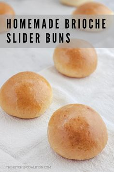 homemade brioche slider buns on a white towel with text overlay