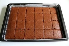 a pan filled with brownies sitting on top of a table