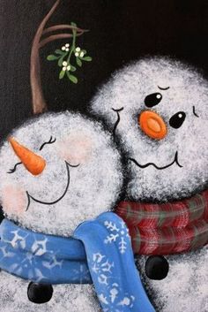 two snowmen are hugging each other in front of a tree