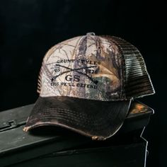 Looking for a super stylish and practical hat that will keep you cool in the summer and warm in the winter? Look no further than the Grunt Style Realtree Xtra GS Embroidered Logo Flag Hat! This chino twill cap features a 6-panel design with a soft mesh back and an embroidered Grunt Style logo on the front. The plastic snapback closure ensures a perfect fit, while the Realtree Xtra camouflage print keeps you looking sharp whether you're out in the woods or just running errands around town. So don't just put any old hat on your head - step up your style game with the Grunt Style Realtree Xtra GS Embroidered Logo Flag Hat! Shop our entire Grunt Style Collection Here Product Info This hat is a structured 6 panel chino twill Realtree Xtra® Camo/soft mesh back Cap with an embroidered Grunt Style Gym Images, Flag Hat, Grunt Style, Patriotic Outfit, Camouflage Print, Old Glory, Hats For Sale, In The Winter, In The Woods