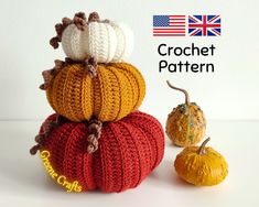 crochet pumpkins are stacked on top of each other