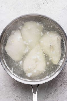 some food is cooking in a pot on the stove top, and it looks like they are boiling