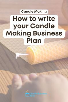 someone is writing on a piece of paper with the words how to write your candle making business plan