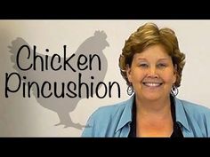 a woman standing in front of a sign that says chicken pincusion on it