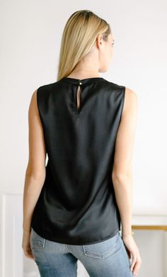 Meet the perfect silk shell top. 100% luxury charmeuse silk. This elevated silk tank can be worn alone or under your favorite blazer – you'll look equally fabulous either way. Elegant and classy with a versatile and minimalist silhouette. Satin V-neck Top For Office, Fitted Silk Tank Top For Work, Chic Silk Tank Top For Work, Silk Tank Top For Workwear In Spring, Classic Silk Top For Night Out, Sleeveless Sleek Blouse For Party, Sleek Sleeveless Blouse For Party, Classic Black Satin Top, Workwear Sleeveless Silk Blouse