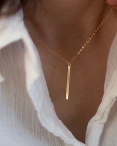 Simple gold bar necklace, featuring 14K gold filled pendant, chain and findings/ Sterling silver pendant, chain and findings. Bar measures 2.5 X 21mm Turn this necklace also a Back necklace Check out our clip on Back Necklace Chain : https://www.etsy.com/listing/250871895/mini-bead-back-necklace-dainty-beck-drop?ref=shop_home_active_1 ■ SHIPPING UPGRADES You can find shipping upgrades options in the drop bar menu when you check out.  * Within the U.S Regular First-class : 2-6 business days Prior Gold Bar Necklace With Rectangular Pendant For Everyday, Minimalist Jewelry With Delicate Chain And Rectangular Pendant, Minimalist Yellow Gold Sterling Silver Bar Necklace, Minimalist Yellow Gold Bar Necklace, Minimalist Bar Necklace With Delicate Chain As Gift, Minimalist Bar Necklace With Delicate Chain For Gift, Minimalist Gold Bar Necklace As Gift, Minimalist Gold Bar Necklace For Gift, Dainty Gold Bar Necklace With Rectangular Pendant