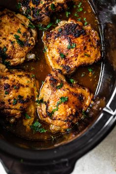 chicken thighs in a slow cooker with parsley