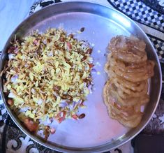 some food is in a metal bowl on a table