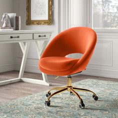 a yellow office chair sits in front of a desk with a white and gold framed painting