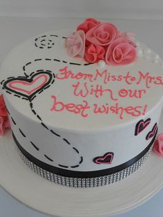 a white cake with pink roses on top and the words grandma made with our best wishes