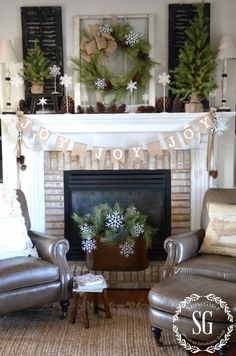 a living room decorated for christmas with stockings and wreaths on the mantel above