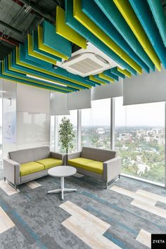 Colorful Ceiling Design idea Corporate Office Space, Patterned Flooring, Bright Ceiling, Modern Sofa Design, Collaborative Office, Eyewear Store Design, Office Space Corporate