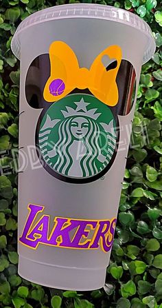 a starbucks cup with the word lakers on it