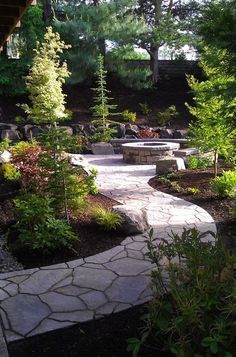 a stone walkway in the middle of a garden