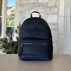 Guaranteed Authentic Brand New With Tags Attached Kate Spade New York Ella Ksnyl Puffy Backpack Bag Kc550 Black (001) Women Nwt Measurements 11.8" W X 15.72" H X 6.4" D Handle Drop: 2.5" Features Embroidered Logo Closure Type: Zip Around Closure Dust Bag Included: No Interior: Back 13" Laptop Slip Pocket, Back Slip Pockets, Front Credit Card Slots Exterior: Front Zip Pocket Materials Recycled Nylon Trim: Smooth Pvc Trim Lining: Two Way Script Logo Lining Imported Style Number Kc550 Smoke/Pet Fre Kate Spade Casual Standard Backpack, Kate Spade Casual Backpack, Trendy Kate Spade Standard Backpack, Trendy Kate Spade Backpack, Kate Spade Casual School Backpack, Casual Kate Spade School Backpack, Kate Spade Casual Backpack For On-the-go, Casual Kate Spade Backpack For On-the-go, Casual Kate Spade Bag For School