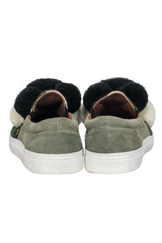 Go for some sporty and whimsical style with these playful pom-pom slip-ons from Figue! Made with a green suede and textile upper, these are a voluminous statement shoe to pair with midi dresses, jeans or your favorite denim shorts for a casual statement. Size 9.5 (EU 40) Suede and textile upper Rounded toe with stitching and beading Pom-pom design Leather interior with no signs of wear Man-made sole with no signs of wear Slip on style, no closures Outsole measures 11" Casual Green Winter Sneakers, Casual Green Sneakers For Winter, Sporty Green Winter Sneakers, Green Sporty Sneakers, French Girl Chic, Whimsical Style, Statement Shoe, Chic Shop, Whimsical Fashion