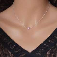 "This freshwater pearl choker is so dainty and pretty. A genuine, lavender-coloured pearl is centered on sterling silver chain in this piece. This sweet pearl is almost perfectly round and measures about 6mm in diameter. The pearl sits right at the hollow of your throat, making this a great layering piece. Little pearls connect the sterling lobster clasp. The necklace shown is approx. 16\" (40.6cm) long, so it is a little longer than the traditional choker length. Different lengths may be chosen Dainty Pink Pearl Necklace Gift, Dainty Pink Pearl Necklace For Gift, Dainty Pink Pearl Necklace, Purple Pearl Chain Jewelry For Gift, Purple Pearl Chain Necklace As A Gift, Jewelry Layering, Small Gift Bags, Pearl Choker Necklace, Pearl Choker