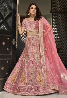 Pink velvet circular lehenga choli 9604 Desc: Style : Circular Lehenga Choli Color : Pink Fabric : Velvet Work : Embroidery Wash Care : Dry clean Sleeve Style : Half Sleeve Long Sleeves : Done only in Custom Stitch Sleeves Lining : Done only in Custom Stitch Bust Size : 32 to 42 Inches Occasion : Wedding Mehendi Sangeet Engagement Reception Ceremonial Baby Shower. With Express Free Shipping Buy Indian Party wedding wear Bridal Lehenga Choli Pink velvet circular lehenga choli 9604 online in USA, Velvet Lengha, Sari Lehenga, Engagement Lehenga, Wedding Lehenga Choli, Velvet Lehenga, Indian Skirt, Festival Attire, Mauve Wedding, Party Wear Lehenga Choli