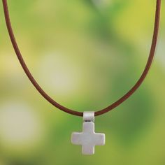 Appealingly simple, this pendant necklace is designed by Rosa Tomatis in Peru. The brushed sterling silver cross centers a brown leather-covered cotton cord. Metal Clay Jewelry, Sterling Pendant, Sterling Silver Necklace Pendants, Metal Clay, Sterling Silver Cross, Artisan Craft, Silver Cross, Cotton Cord, Silver Pendant Necklace