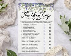 the wedding shoe game is displayed next to flowers and lace on a marble table top