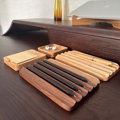 a wooden desk with various items on it