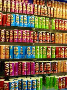 many cans of soda are on display in a store